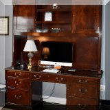 F28. Trosby Furniture of Sussex England executive desk with hutch. Some scratching on front. 90”h x 71”w x 21”d - $750 